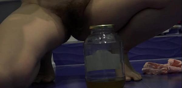  Hairy pussy loves a lot to piss and collect yellow urine in a jar. Fetish compilation with golden shower.